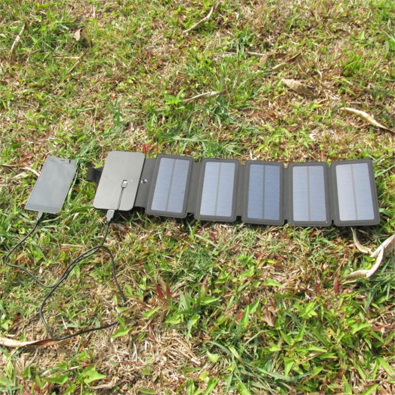 Foldable solar panel on grass