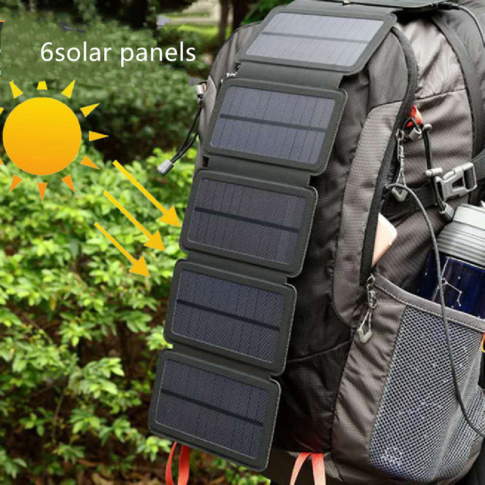 Backpack with solar panel attachment and sun illustration, outdoors.